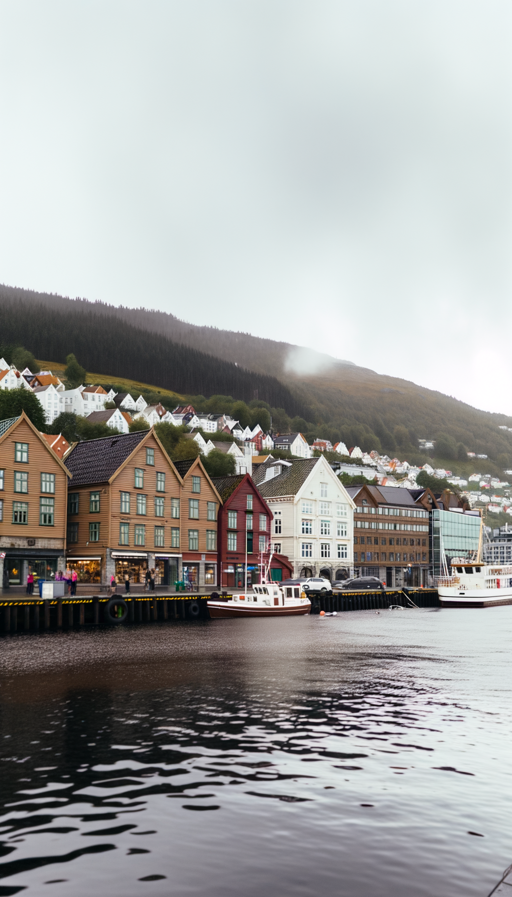 Houses and boats along a calm Norwegian waterfront