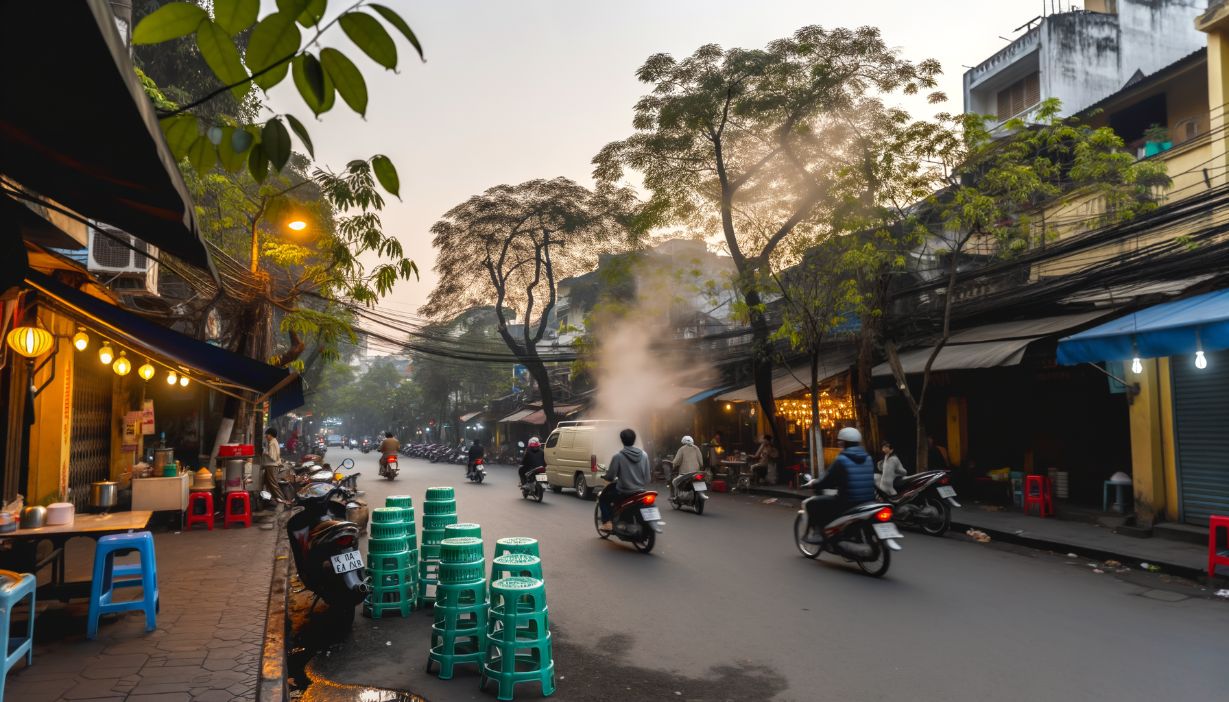 Busy Hanoi street with motorbikes and trees along the road